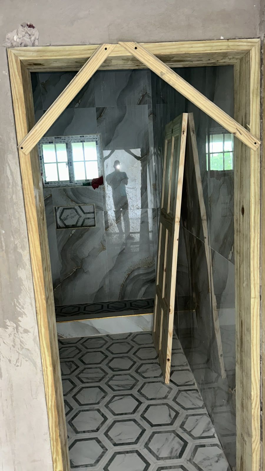 New door frame installation with tiled interior