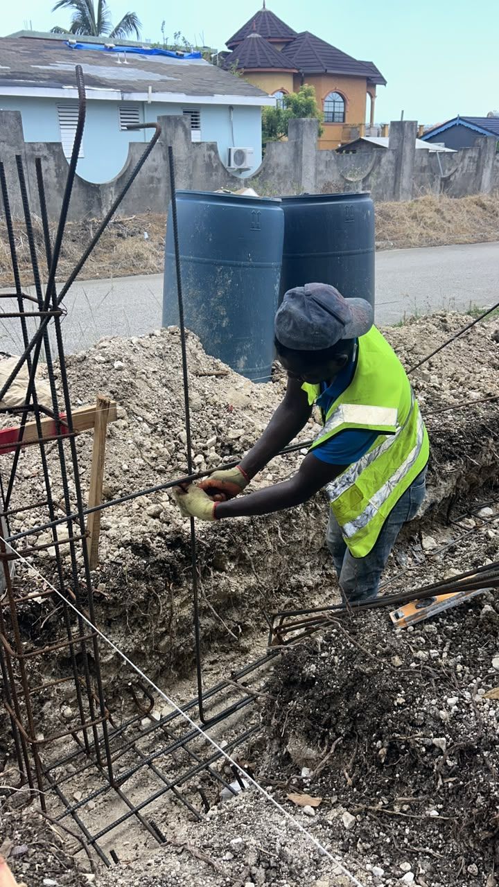 Worker tying rebar on site