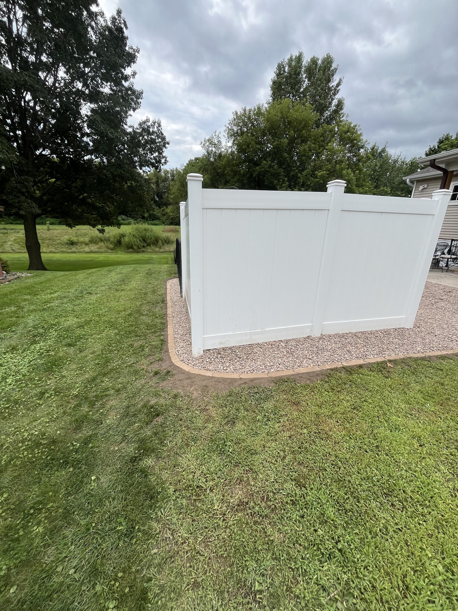 Enhancing Outdoor Spaces with Bullet Edgers and River Rock