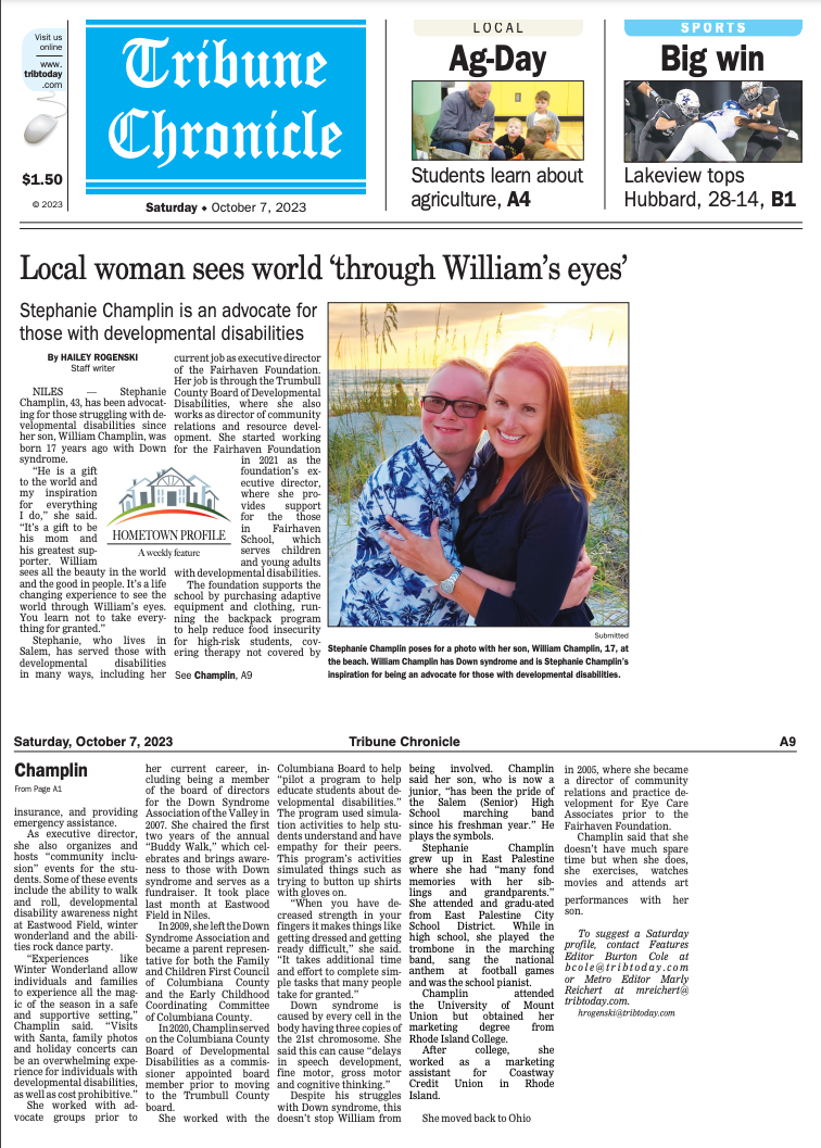 the front page of a newspaper with a picture of two people hugging each other .