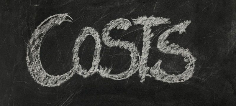 the word costs is written in white chalk on a blackboard the word costs is written in white chalk on a blackboard