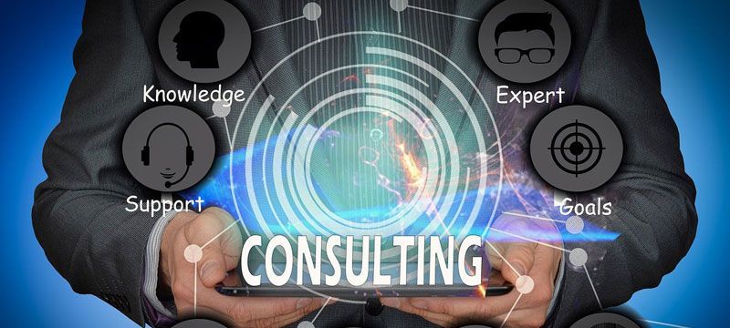 a person holding a tablet with the word consulting on it a person holding a tablet with the word consulting on it