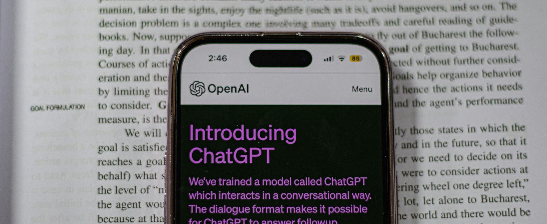 A cell phone with a screen that says introducing chatgpt