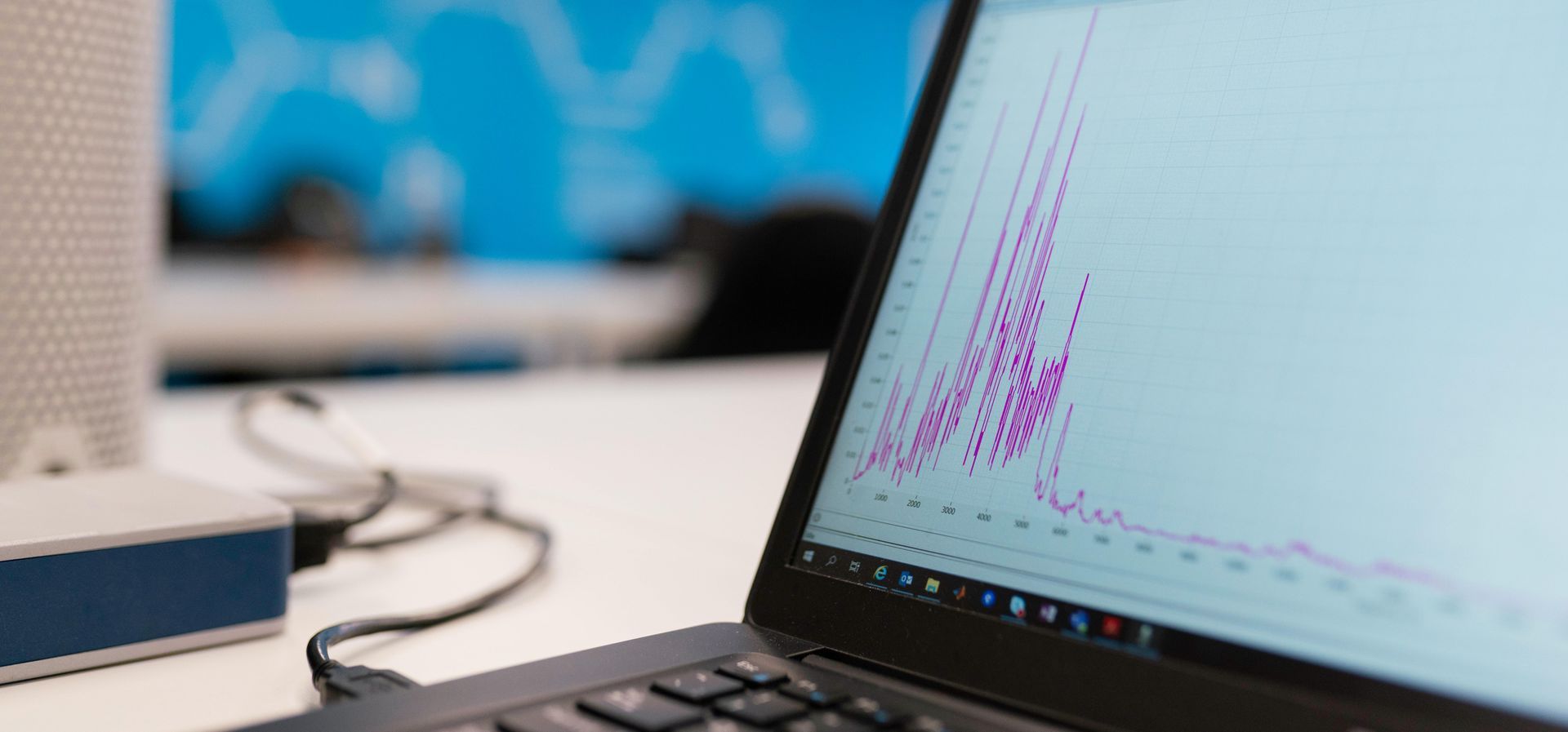 A close up of a laptop computer with a graph on the screen.