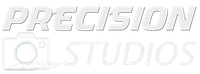 A white logo for precision studios with a picture of a camera.