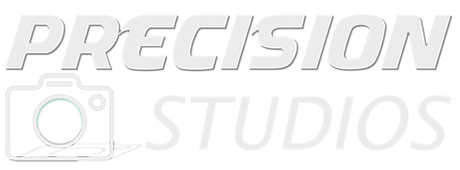 A white logo for precision studios with a picture of a camera.
