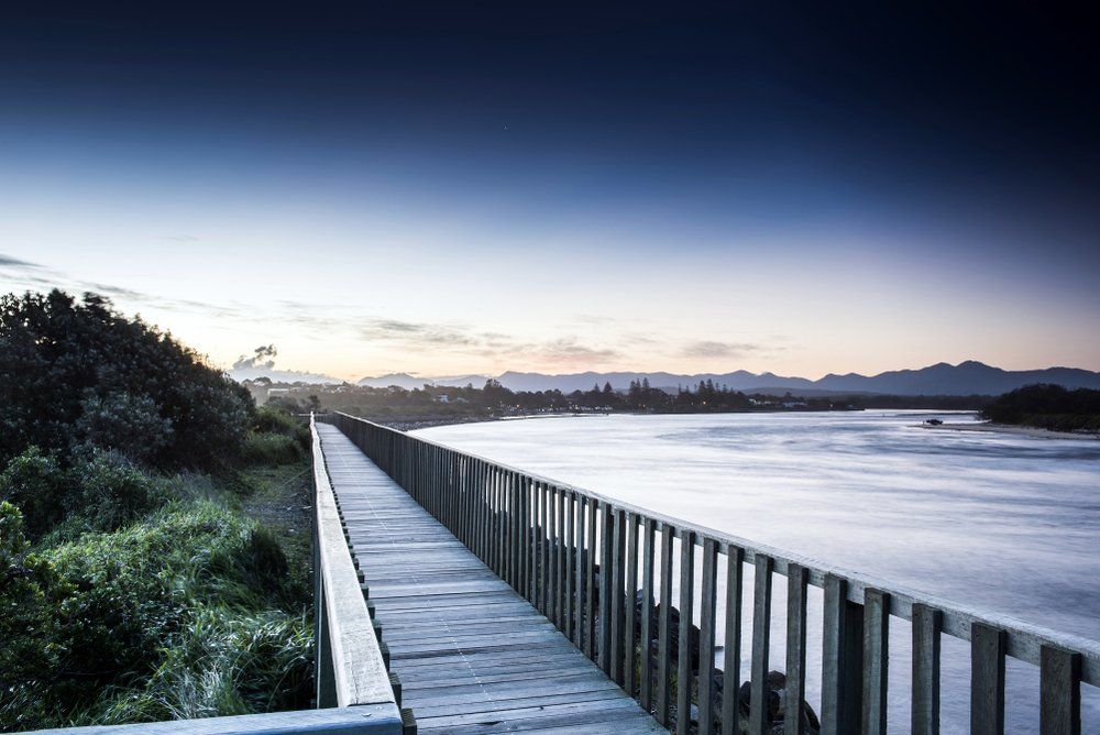 Wooden Bridge Crossing the Foggy River — All Pest Solutions in Mid North Coast, NSW