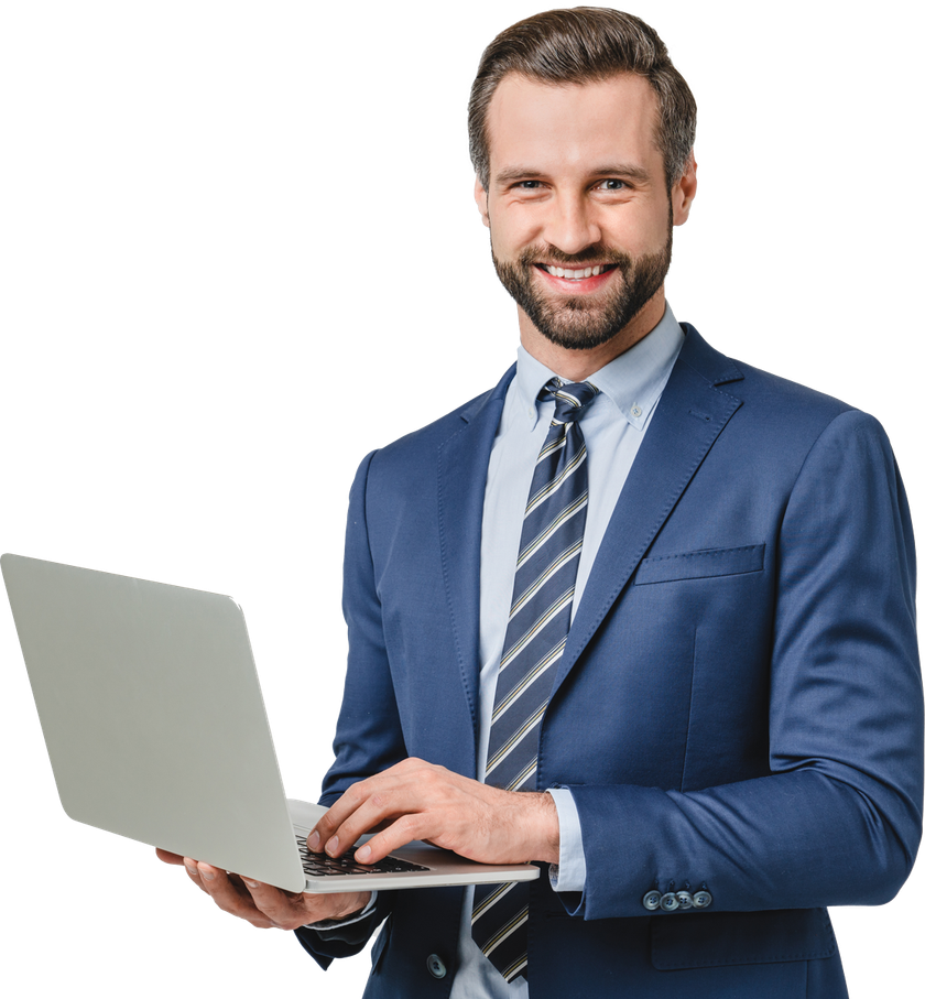 Man in blue suit smiling, holding laptop, typing.