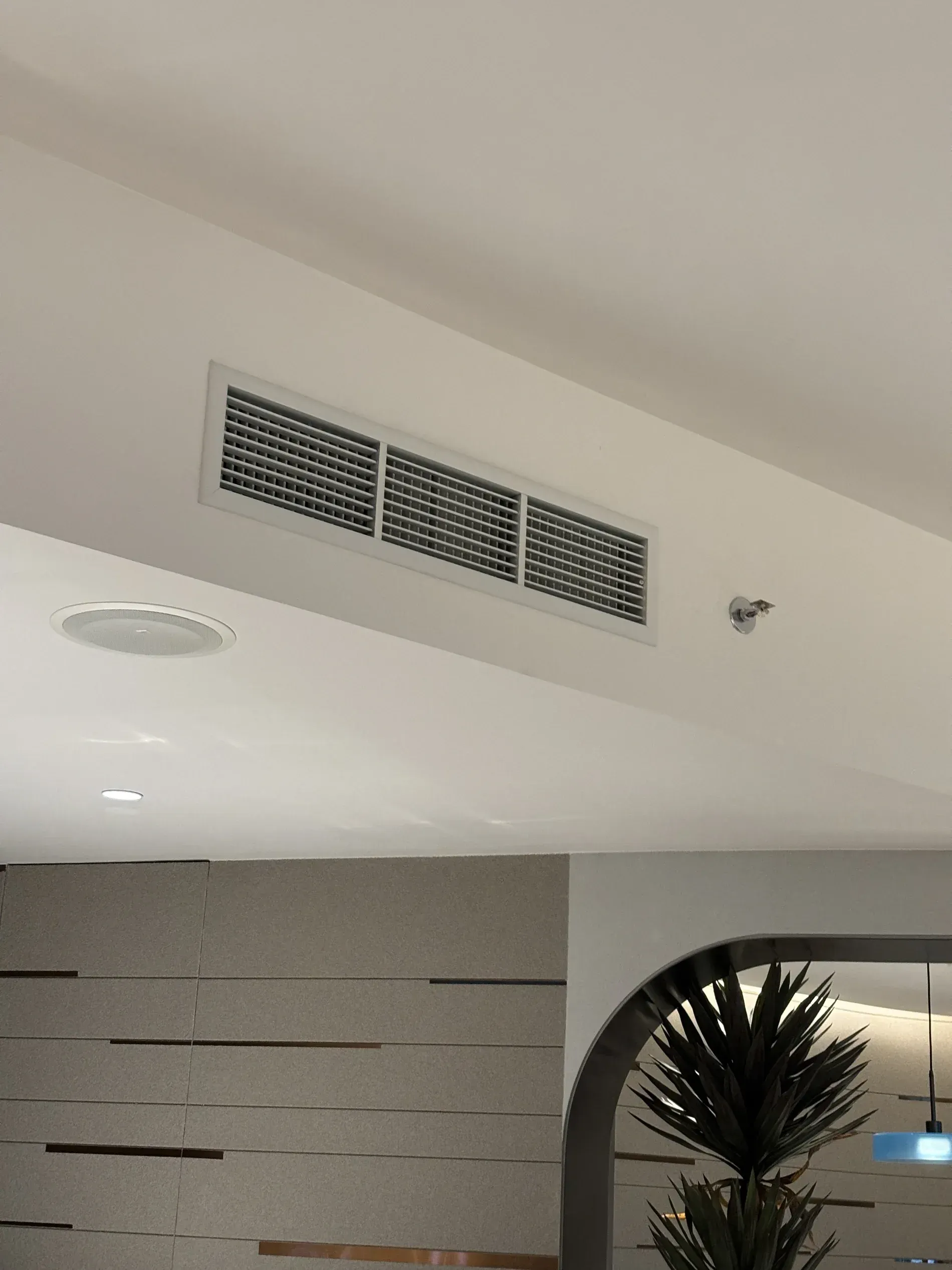 Ceiling Vent Above a Modern Interior Wall With Recessed Lights — Nauticool Refrigeration & Air Conditioning in Cannonvale, QLD