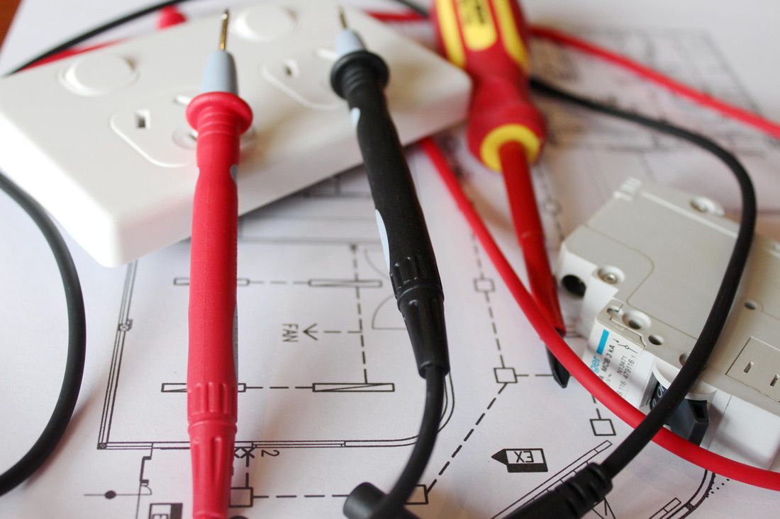 A Bunch of Wires and a Screwdriver on Top of a Drawing — Nauticool Refrigeration & Air Conditioning in Airlie Beach, QLD