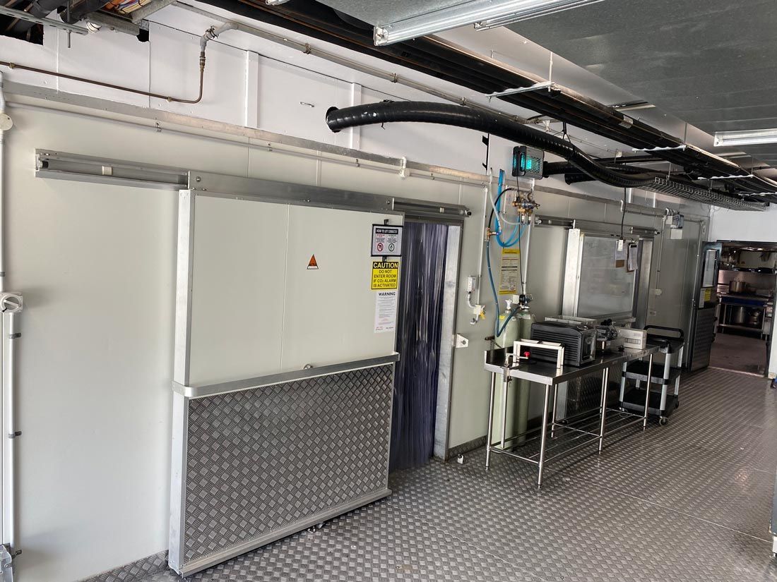 There is a Sliding Door in the Middle of the Room — Nauticool Refrigeration & Air Conditioning in Cannonvale, QLD