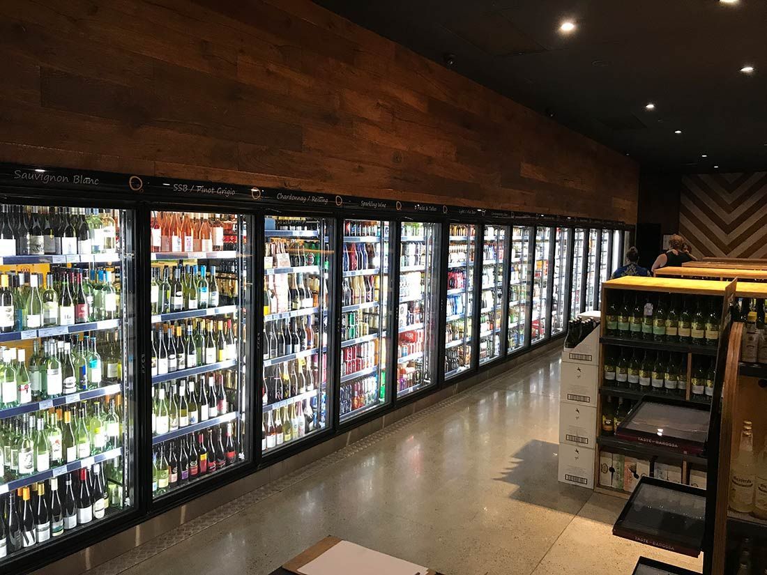 A Liquor Store Filled With Lots of Bottles and Cans — Nauticool Refrigeration & Air Conditioning in Cannonvale, QLD