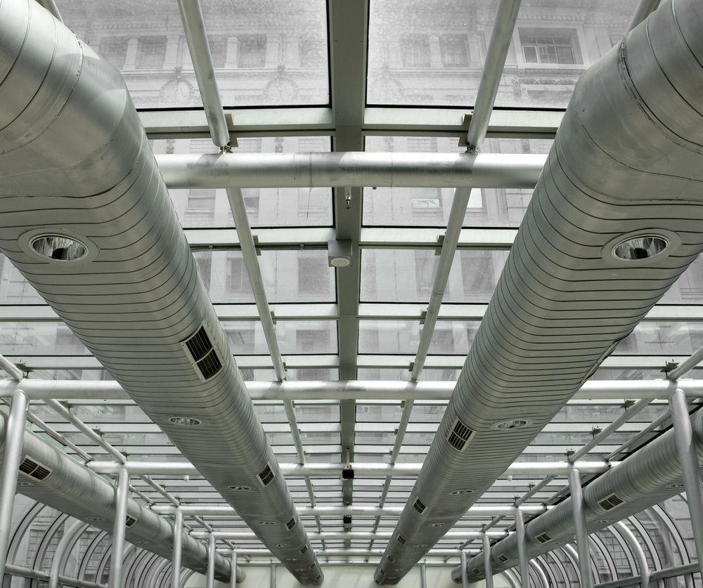 A Ceiling With a Lot of Pipes Going Through It — Nauticool Refrigeration & Air Conditioning in Cannonvale, QLD