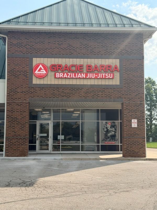 Grace Barra Brazilian Jiu-Jitsu brick storefront with glass entrance and red sign