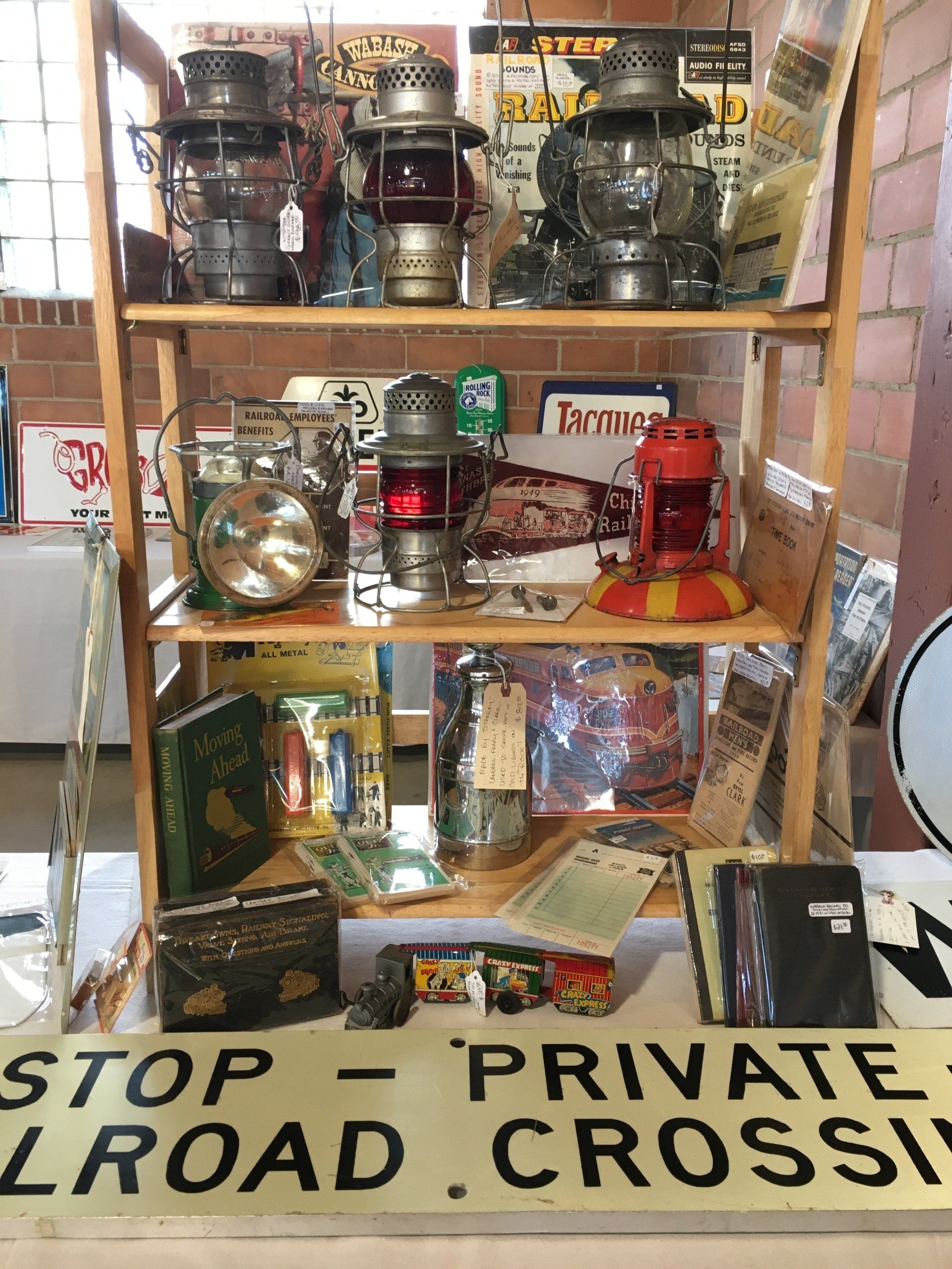 A shelf with a sign that says stop private road crossing