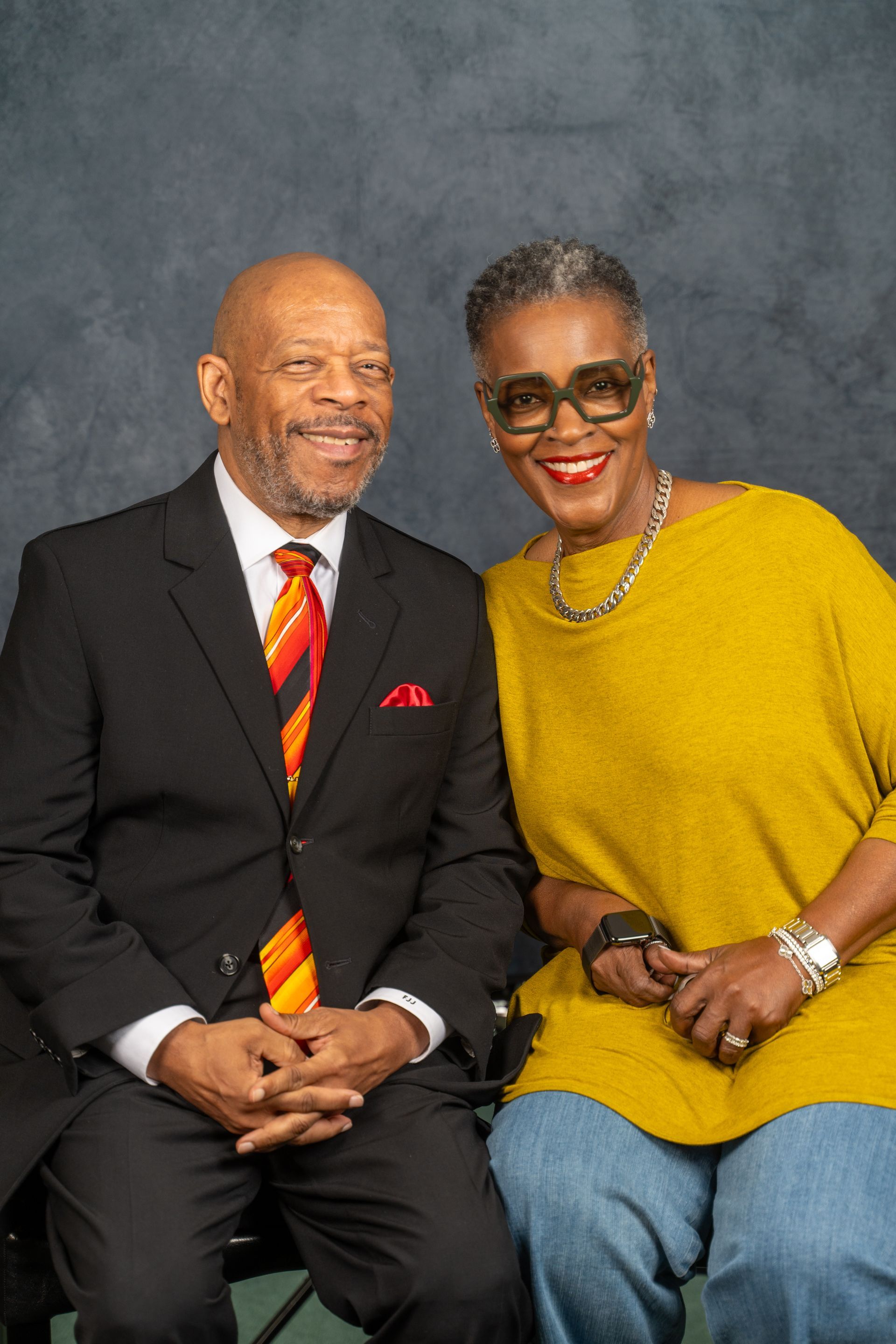 A man and a woman are posing for a picture together
