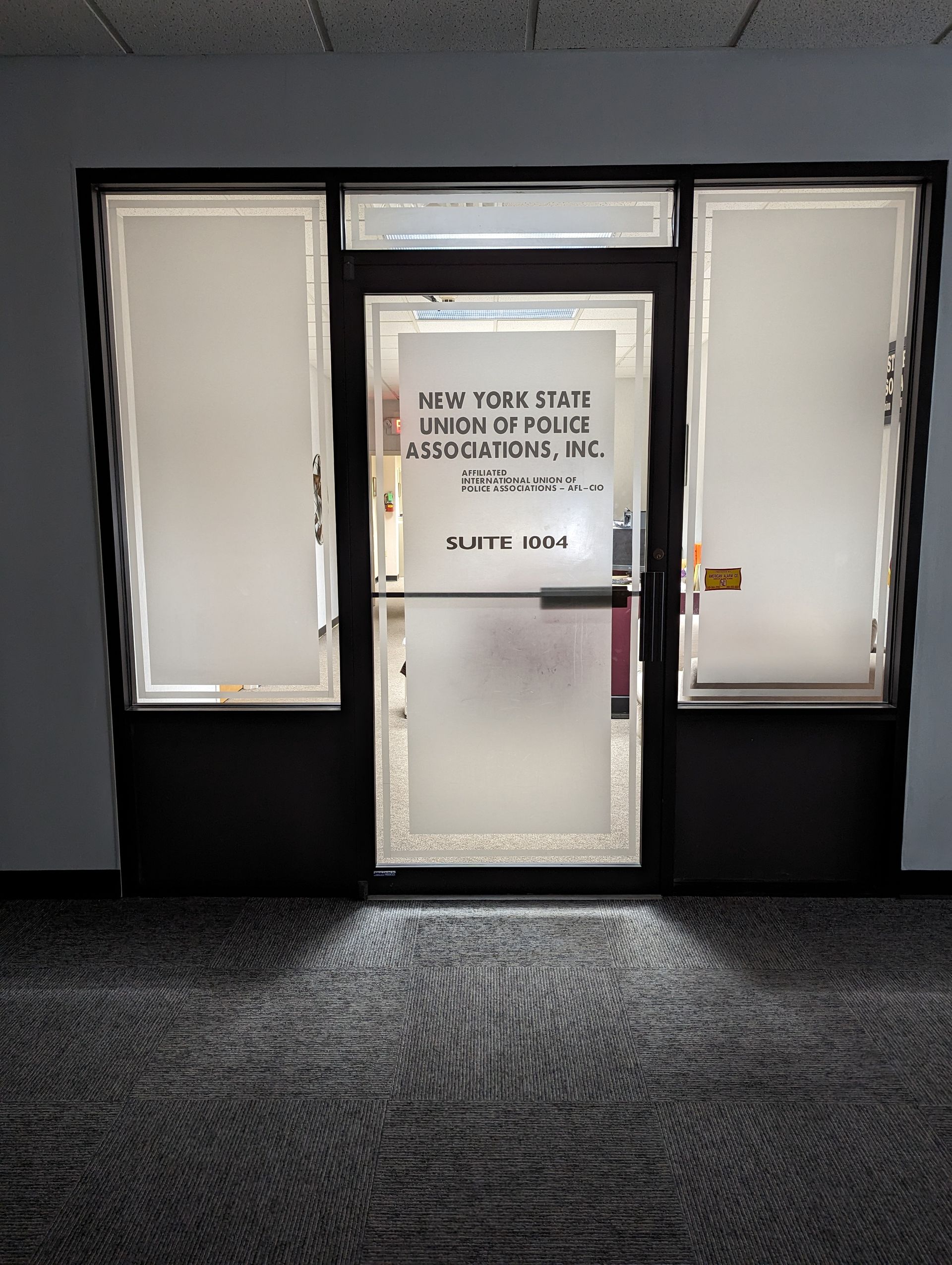 A door with a sign on it that says new york state association inc