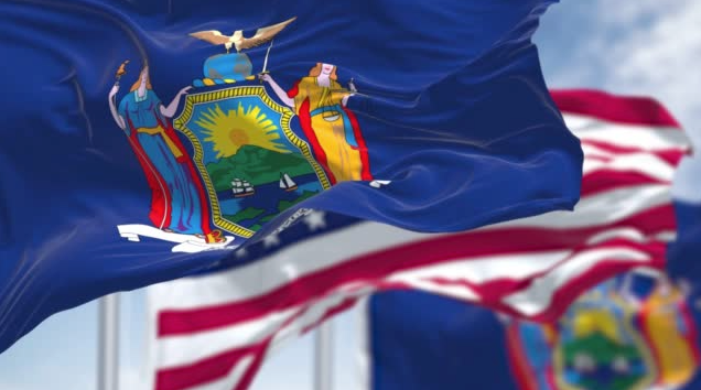 The new york state flag is waving in the wind