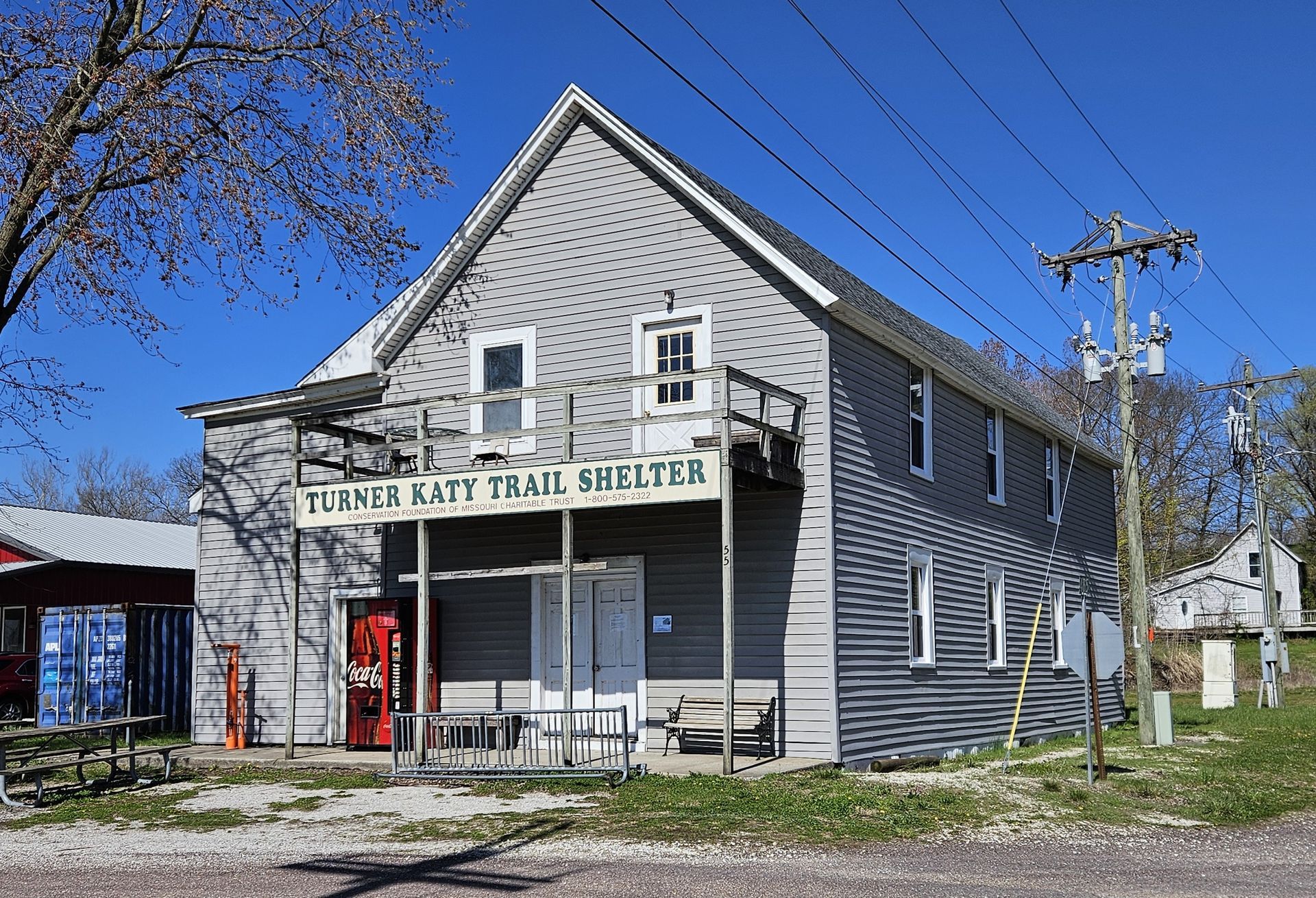 A building with a trail shelter sign on it
