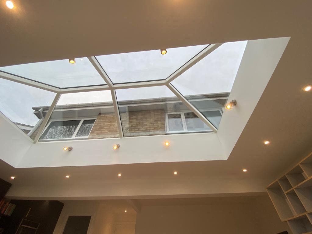 There is a skylight in the ceiling of the room.