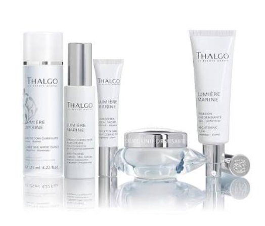 Thalgo skincare product lineup in white and silver packaging on a white background