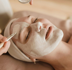 Facial mask applied to a person's face at a spa.