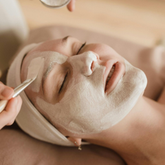 Facial mask applied to a person's face at a spa.