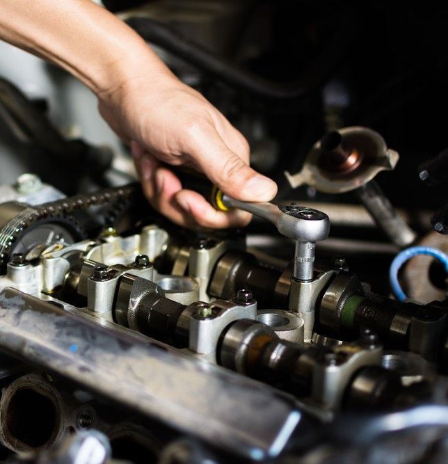 A Person is Working on a Car Engine With a Wrench — Tamworth Manual Transmission Factory in Moree, NSW