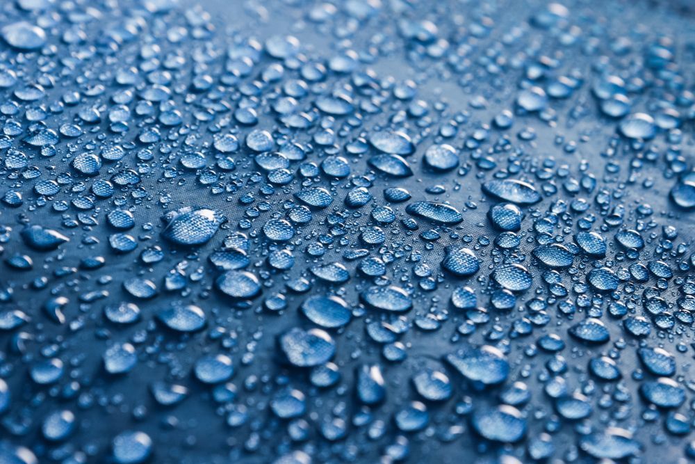A Close Up Of Water Drops On A Blue Surface — Citrus Clean Central Coast In Erina, NSW
