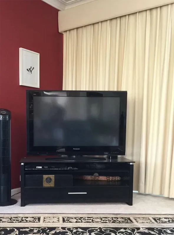 Floor Length Cream Curtain Behind A TV— Citrus Clean Central Coast in Wyong, NSW