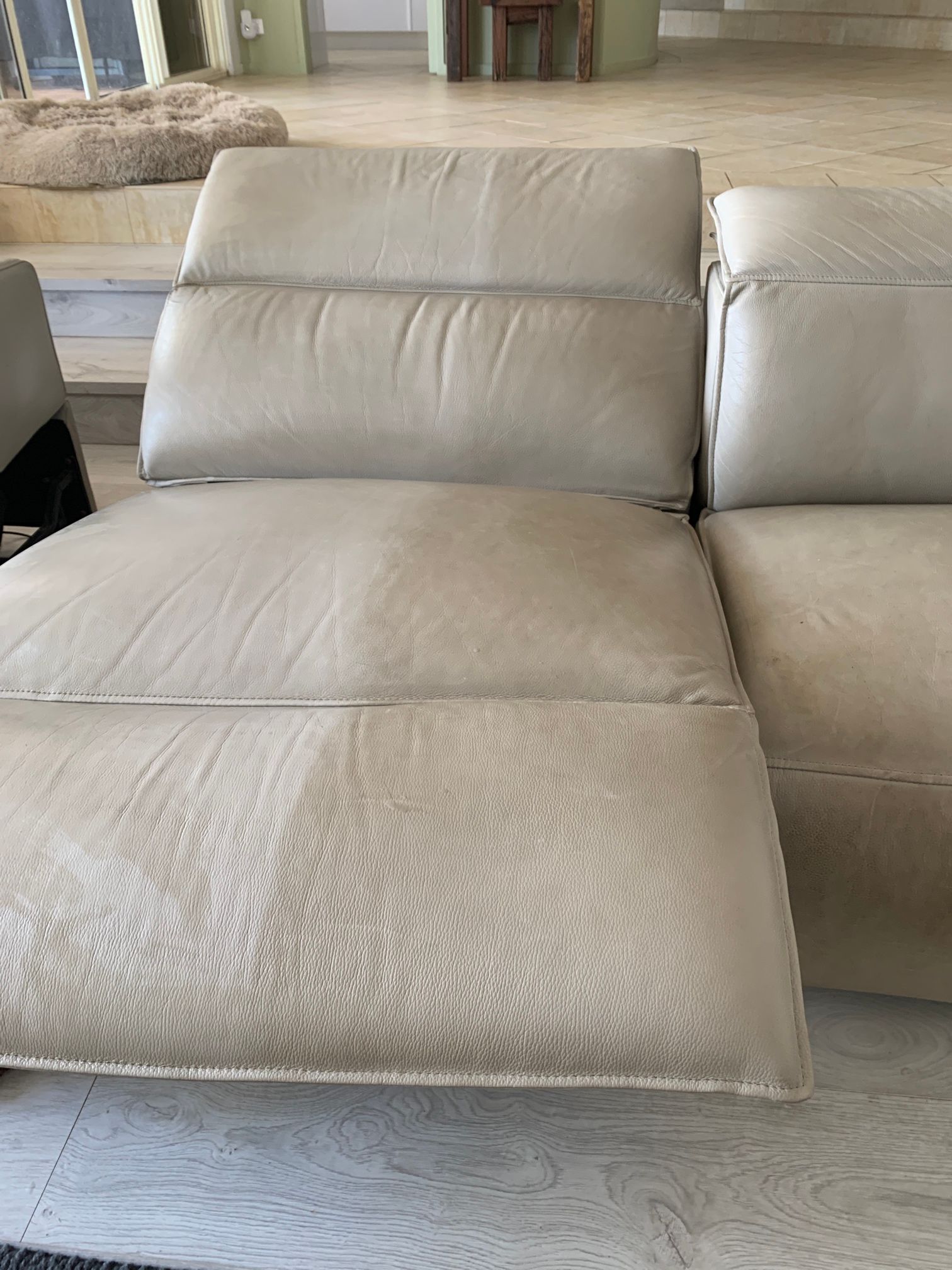 A Person Is Cleaning A Blue Couch With A Cloth — Citrus Clean Central Coast In Lake Haven, NSW
