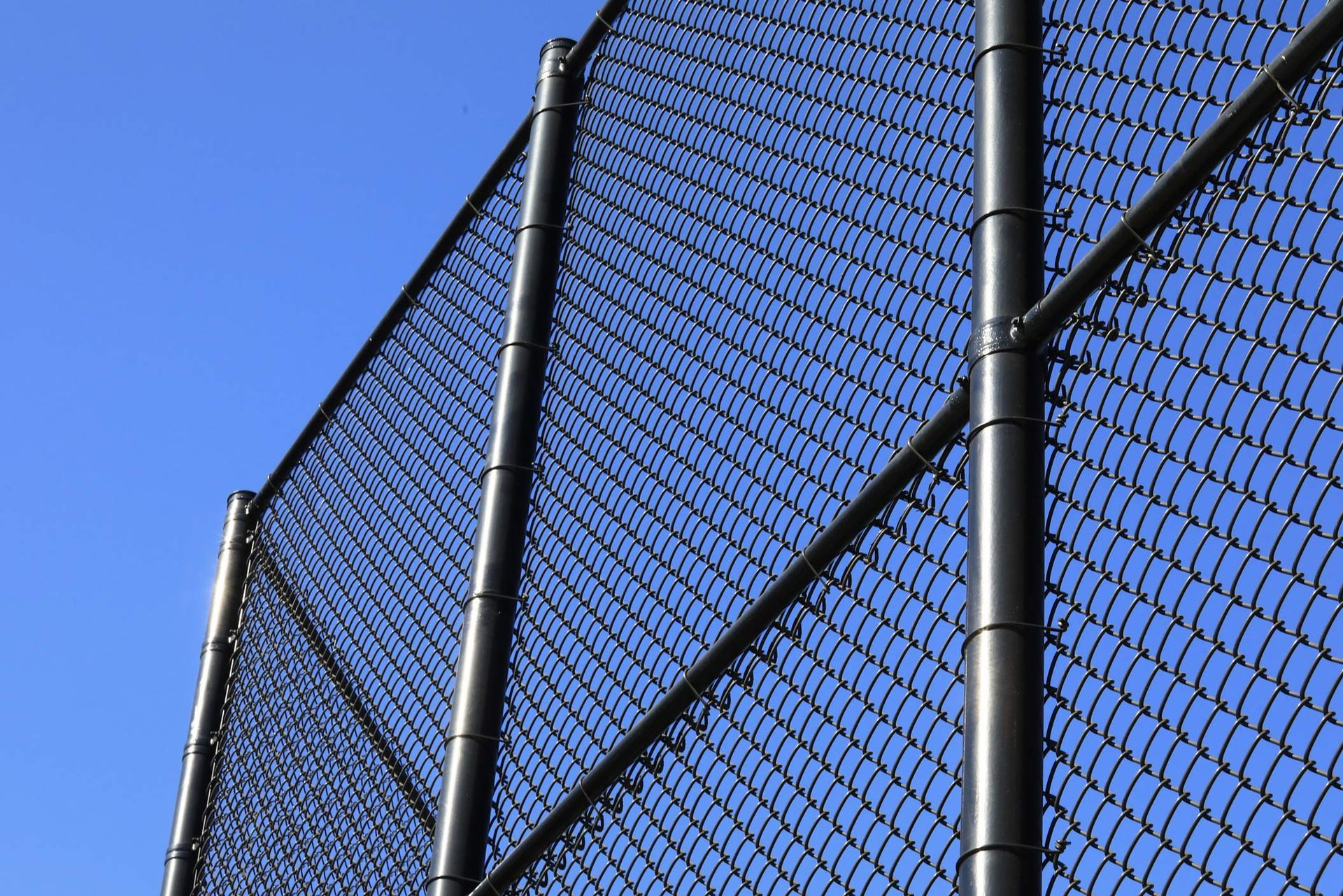 Low angle view of a chain link type fence. Low angle view of a chain link type fence.