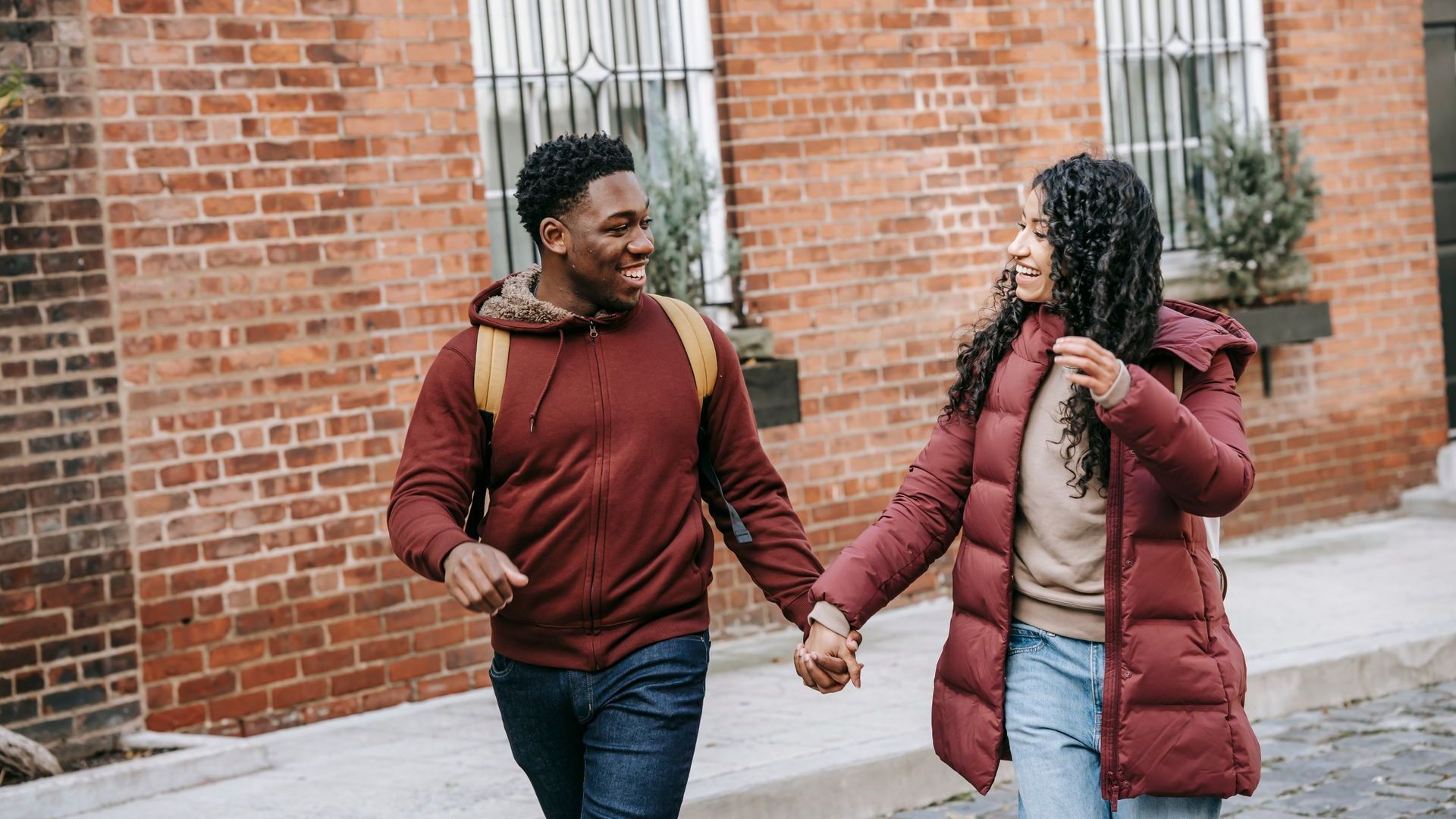 Couple holding hands while walking