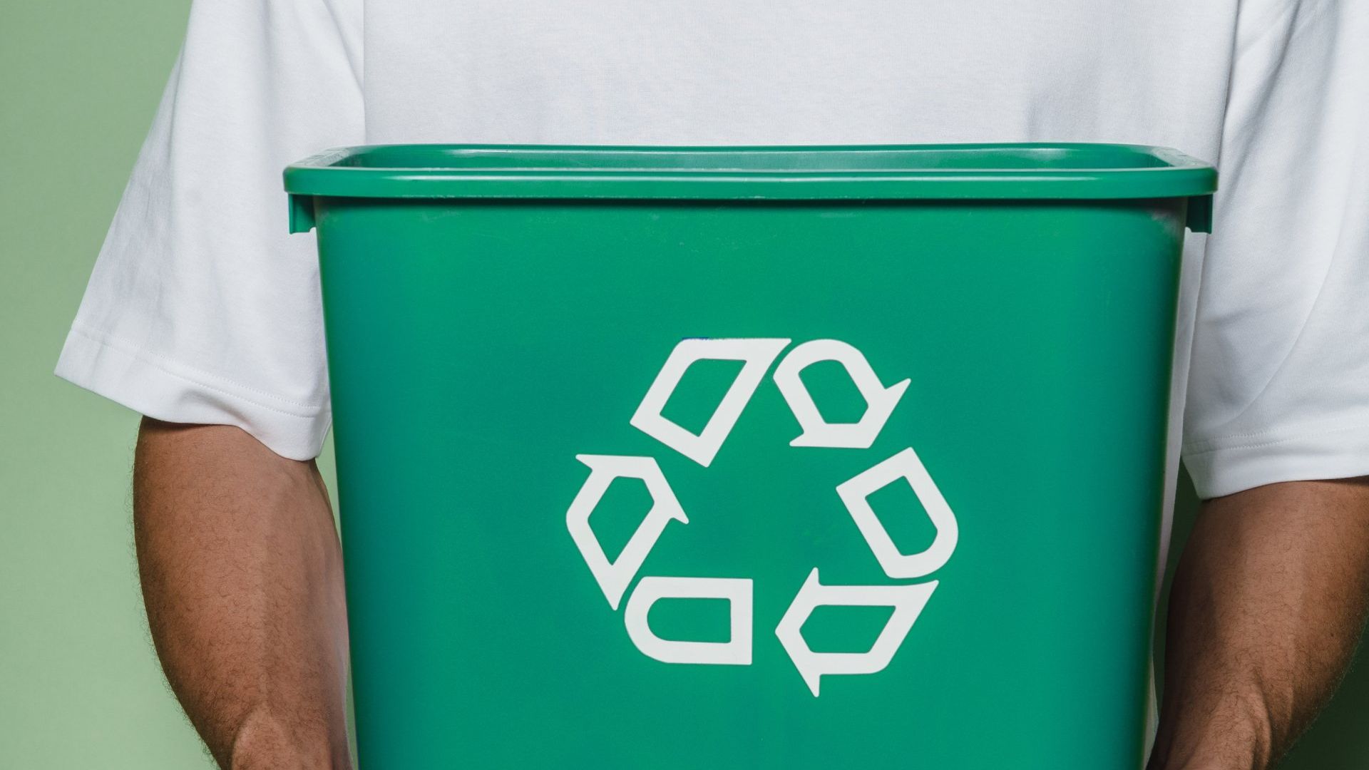 Trash bin with recycle symbol