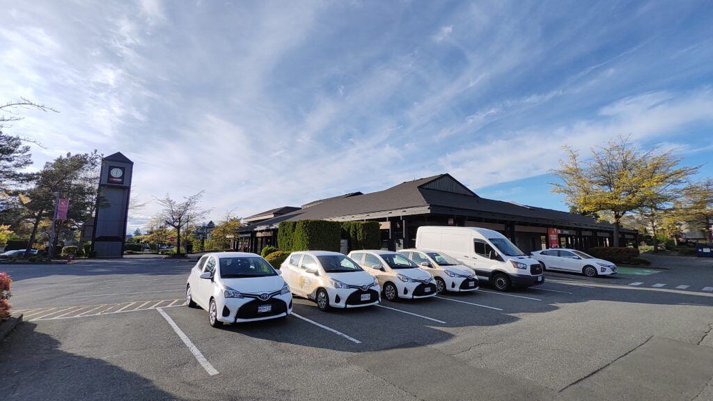 HB Cleaning Solution vehicles sitting in a freshly cleaned parking lot