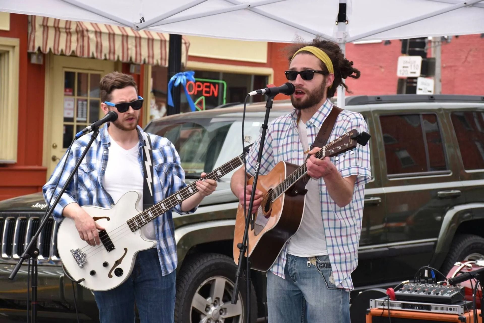 Two musicians performing outdoors | Hermansaders Garage & Auto Sales