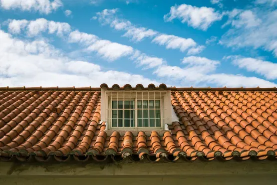 Cracked rubber pipe boot on a Florida roof from UV degradation