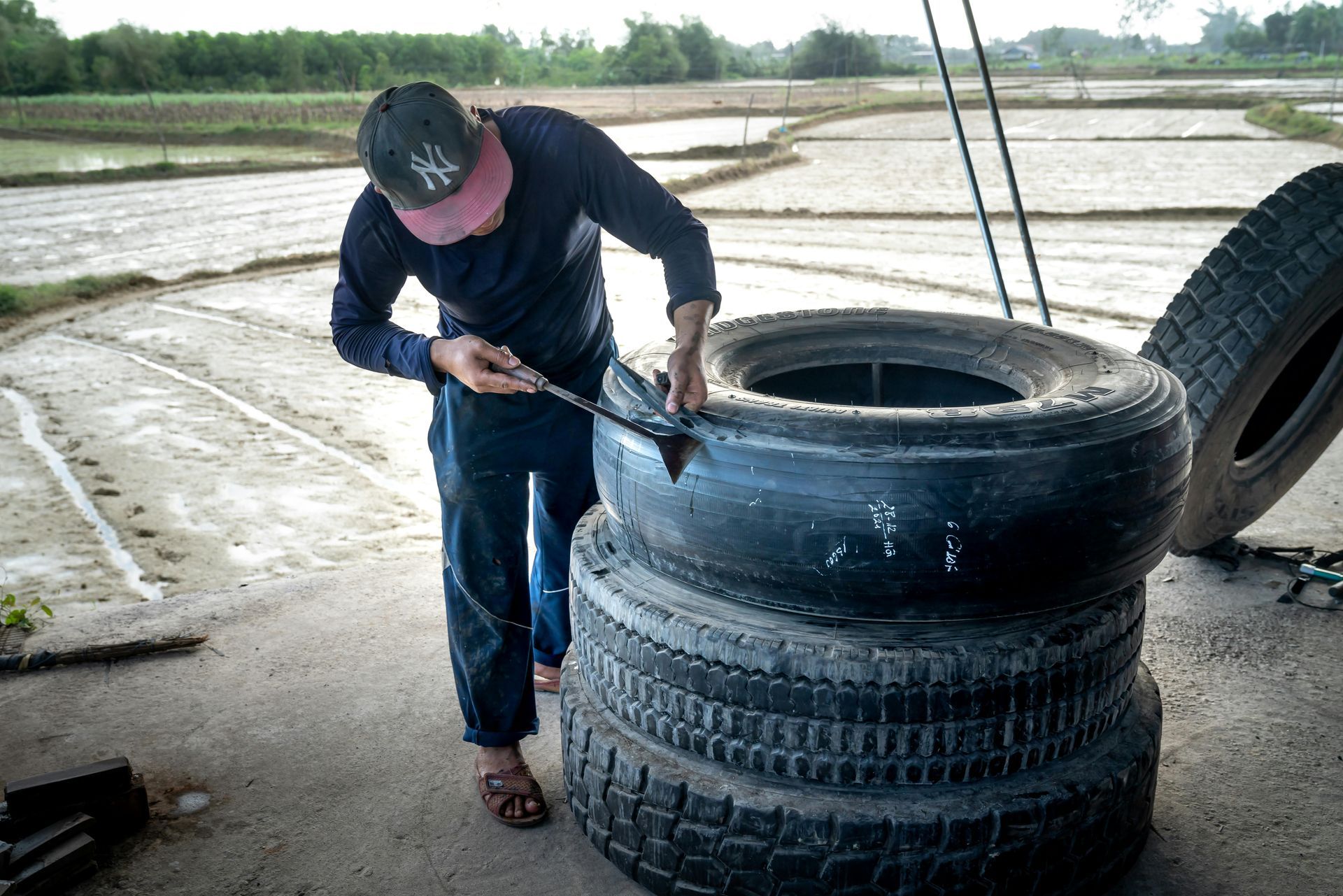 man patching tire