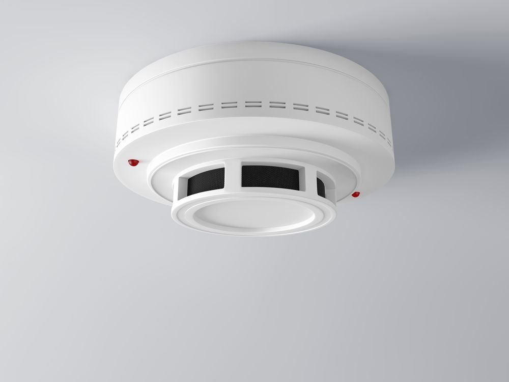 Ceiling-mounted White Smoke Detector With Vents and Test Lights — Fitzroy Fire and Safety in Kawana, QLD
