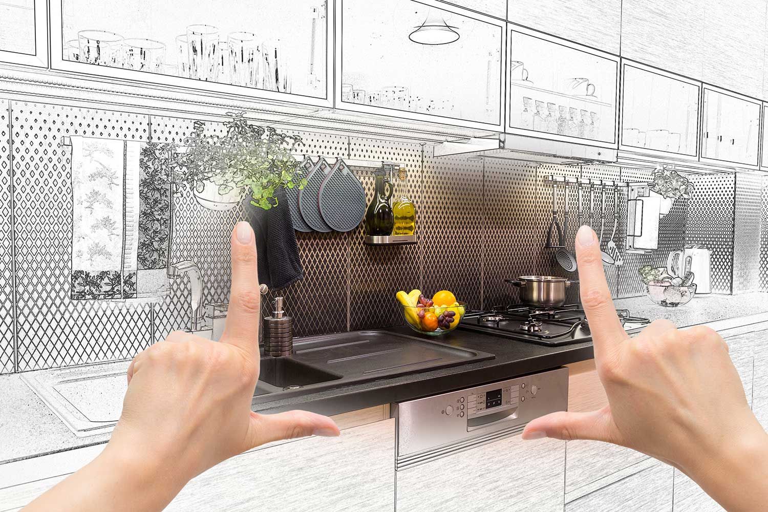 A person is making a picture of a kitchen with their hands.