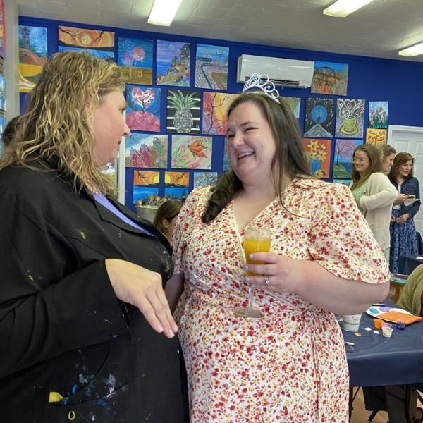ladies having chat and holding a drink