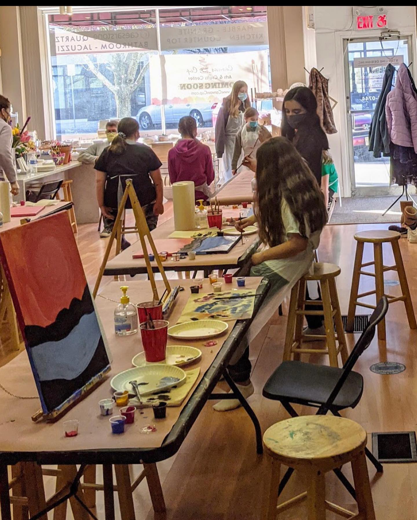 kids painting in art studio during birthday party