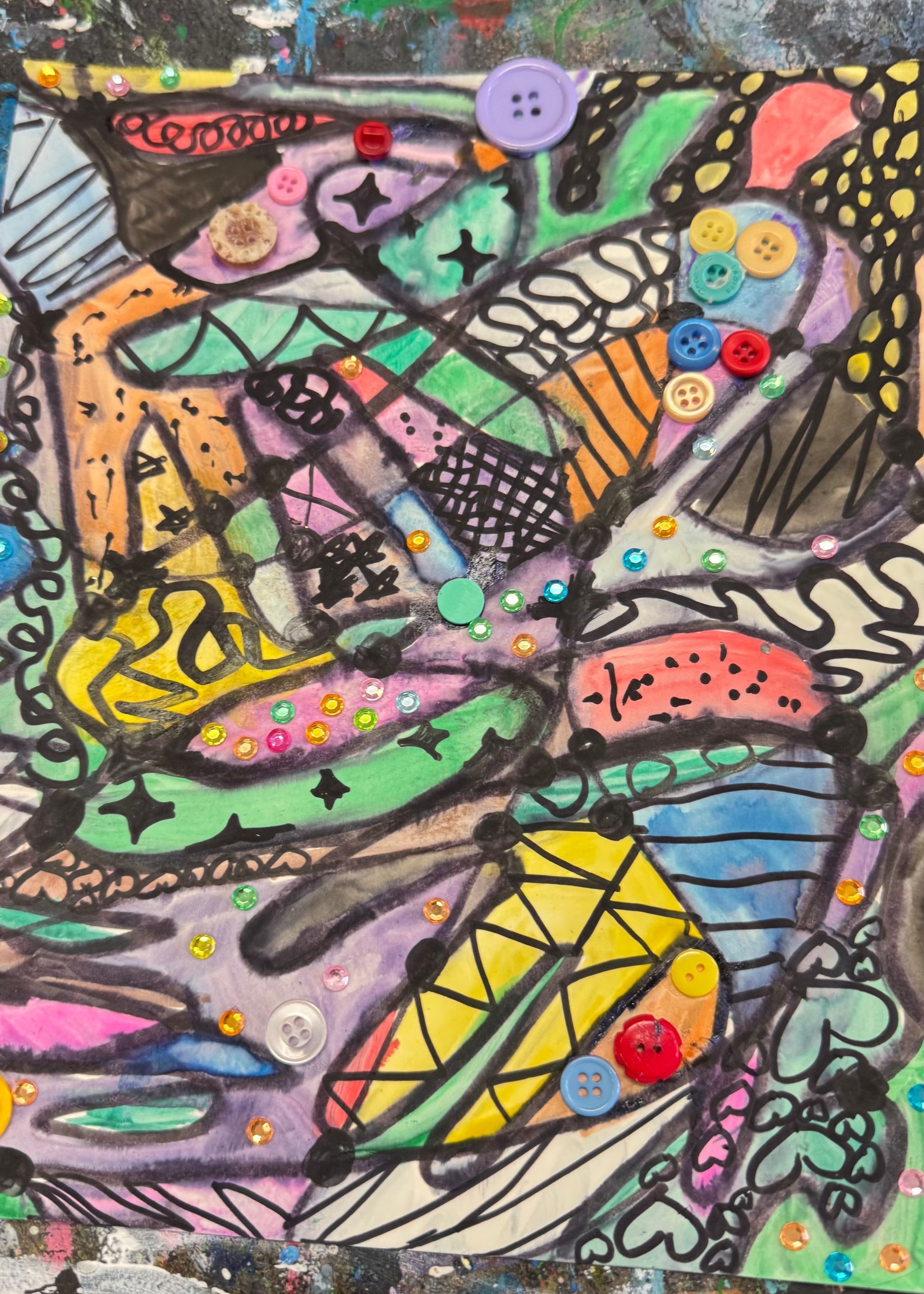 Colorful abstract drawing of overlapping fish shapes with bright dots and patterned scales