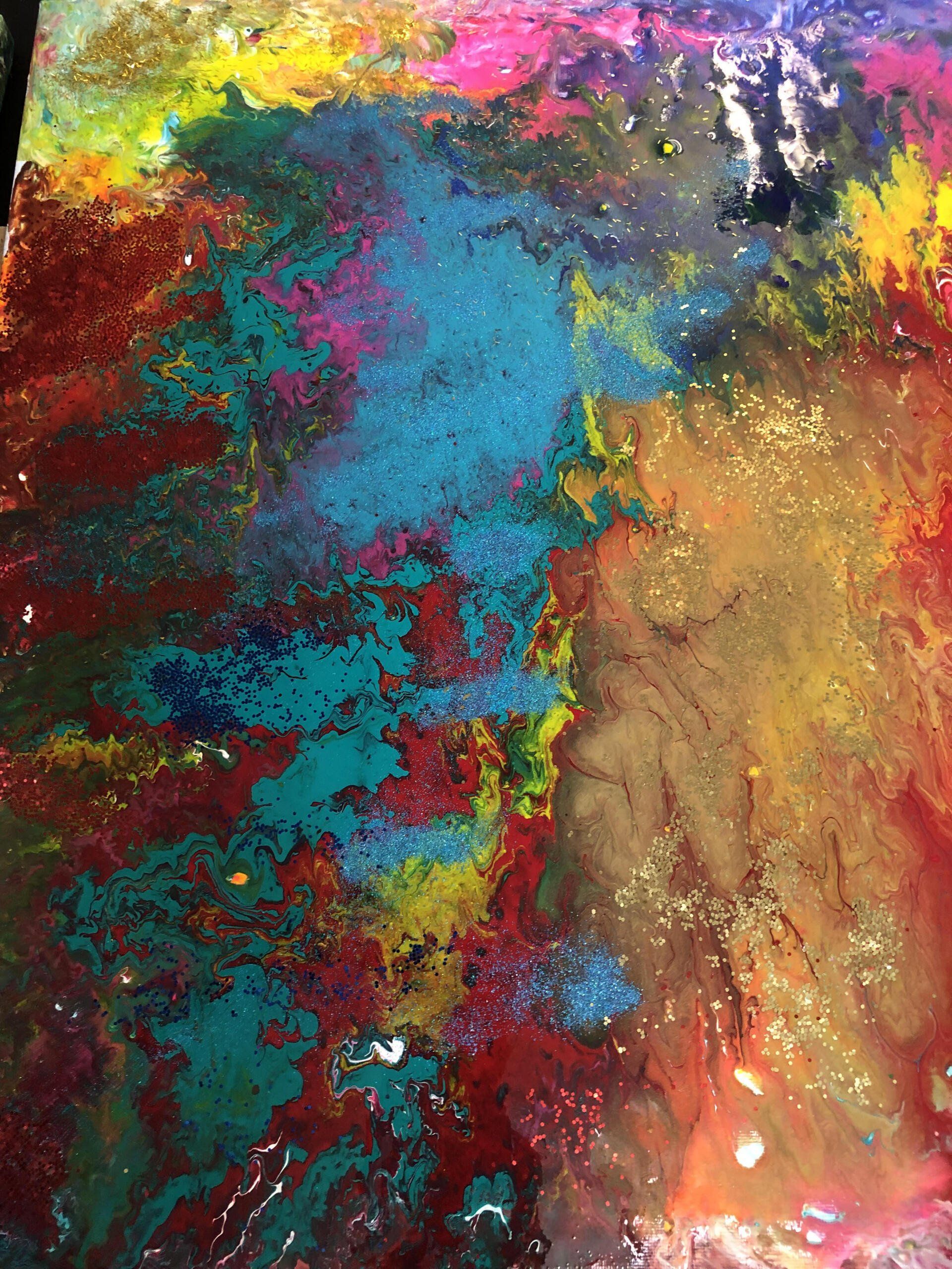 A close up of a colorful painting on a table.