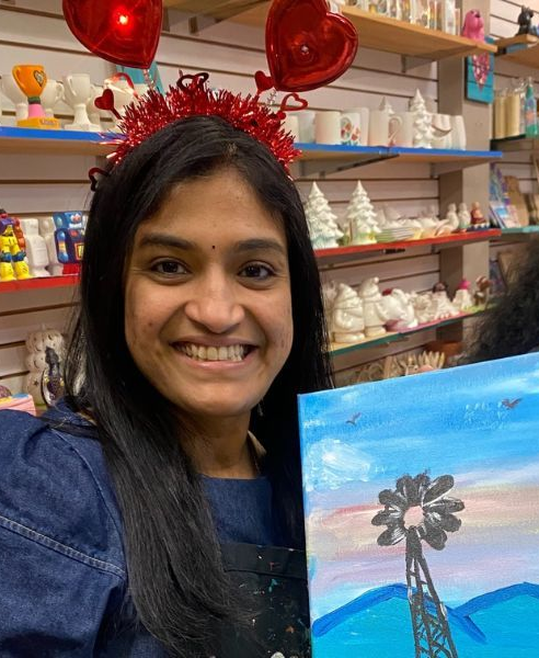 woman painting on canvas