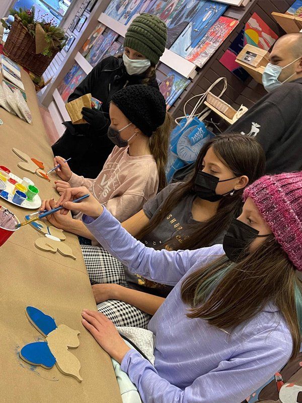 girls painting wood