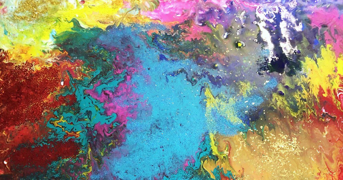 A close up of a colorful painting on a table.