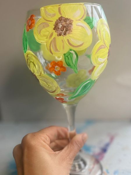 painted yellow flower on glass