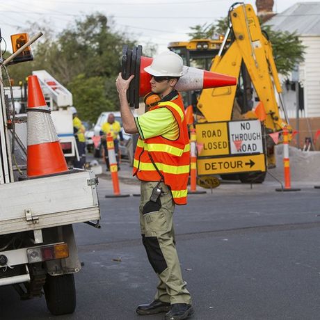 mildura traffic management working holding a board with multiple sign boards 