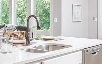 a kitchen with a sink and dishwasher